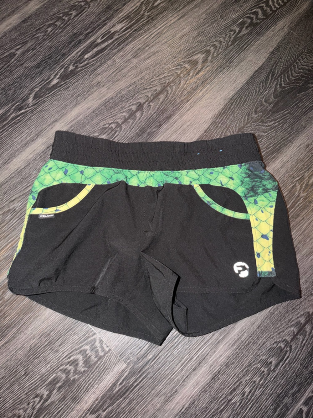 Pelagic Black Fishing Shorts with Green Scale Trim
